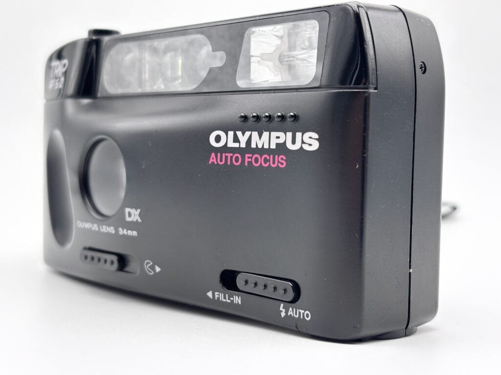 Olympus Trip AF S-2 détail face avant sélecteur Fill-In Auto flash compact argentique