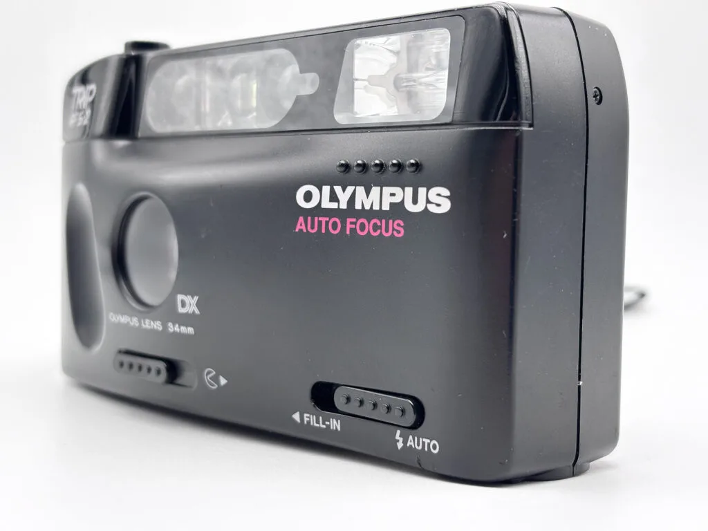 Olympus Trip AF S-2 détail face avant sélecteur Fill-In Auto flash compact argentique